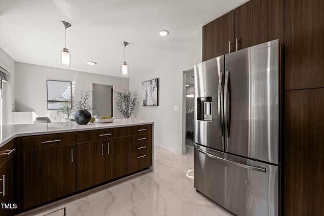 kitchen featuring marble finish floor, dark brown cabinets, and stainless steel refrigerator with ice dispenser