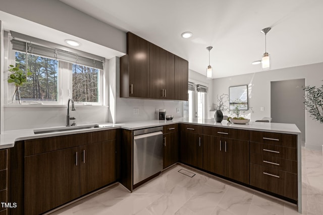 kitchen featuring a wealth of natural light, dishwasher, a peninsula, marble finish floor, and a sink