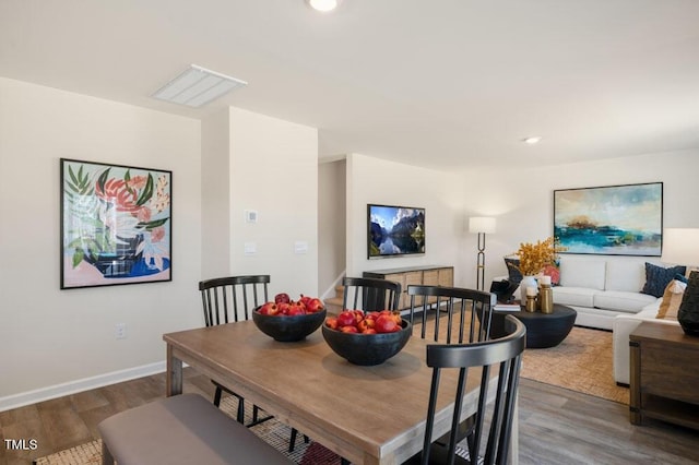 246 Holton St, Smithfield, NC 27577 - dining space with stairs, baseboards, wood finished floors, and recessed lighting