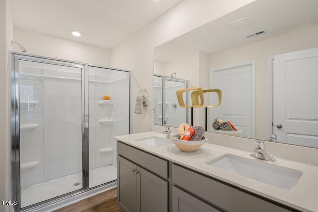 246 Holton St, Smithfield, NC 27577 - bathroom featuring a stall shower, visible vents, a sink, and double vanity