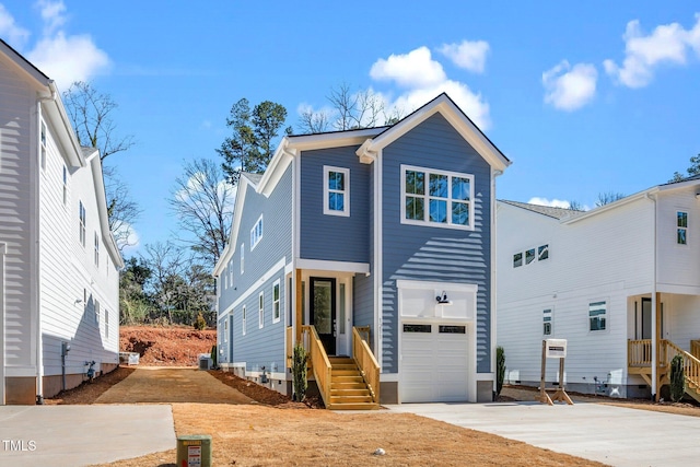 view of front facade with a garage and concrete driveway