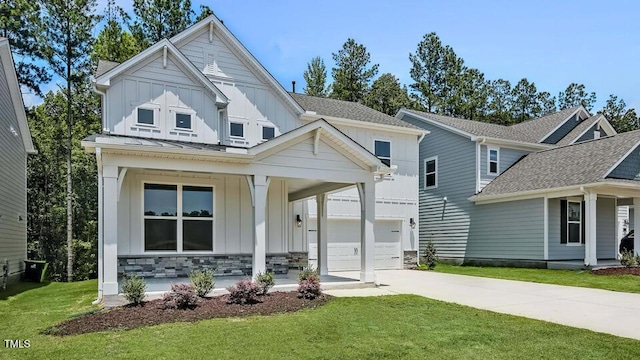 7521 Percussion Dr, Apex, NC 27539 - view of front of house with a porch, board and batten siding, driveway, a front yard, and an attached garage