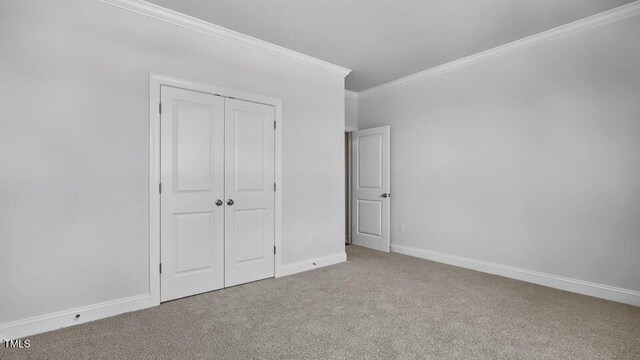 7521 Percussion Dr, Apex, NC 27539 - unfurnished bedroom with carpet floors, crown molding, and a closet