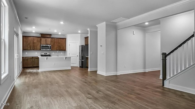 7521 Percussion Dr, Apex, NC 27539 - unfurnished living room with stairway, recessed lighting, dark wood finished floors, and ornamental molding