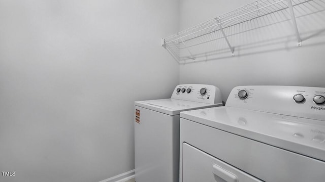 7521 Percussion Dr, Apex, NC 27539 - laundry room with washing machine and dryer and baseboards