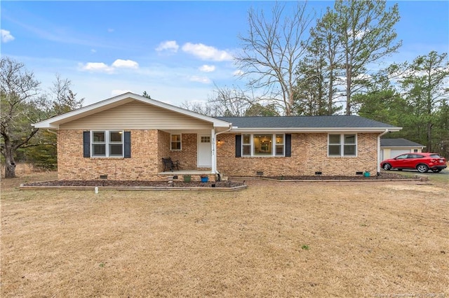 ranch-style home with crawl space, brick siding, and a front lawn