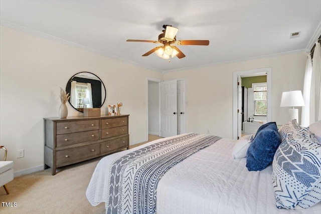 bedroom featuring a ceiling fan, crown molding, light colored carpet, and baseboards