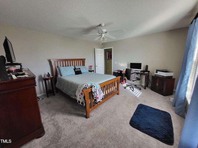 bedroom featuring ceiling fan, a textured ceiling, baseboards, and light colored carpet