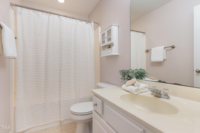 bathroom featuring tile patterned floors, toilet, and vanity