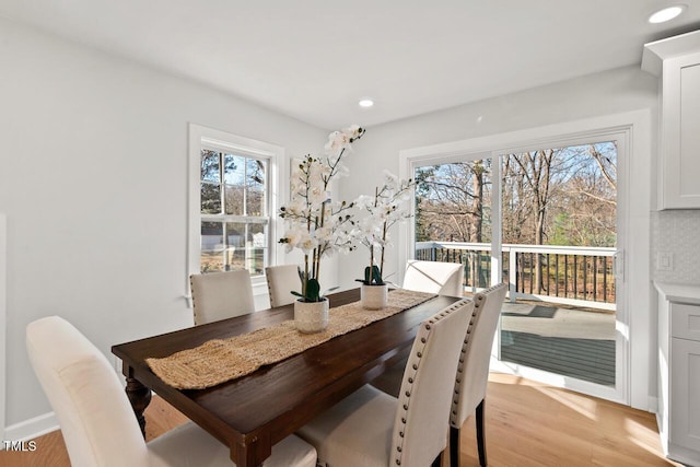 dining area featuring light wood-type flooring and recessed lighting