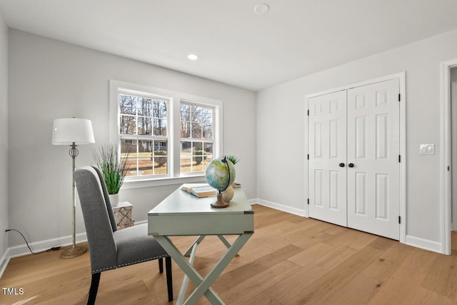 office with light wood finished floors, recessed lighting, and baseboards