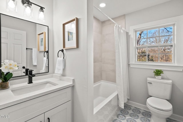 bathroom with toilet, baseboards, shower / bath combination with curtain, and vanity