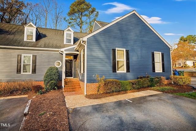 view of front of house with a shingled roof