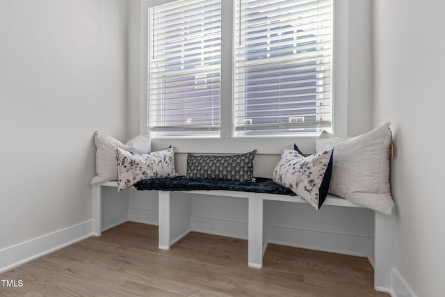 sitting room featuring light wood-type flooring and baseboards