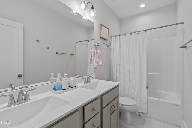 full bathroom with shower / bath combination with curtain, double vanity, a sink, and tile patterned floors