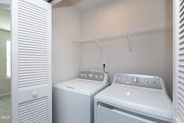 laundry room featuring washer and dryer, laundry area, and carpet