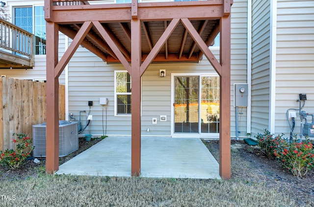 view of patio featuring fence and central AC unit