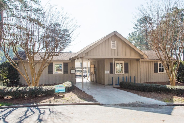 view of front of home with a shingled roof and driveway