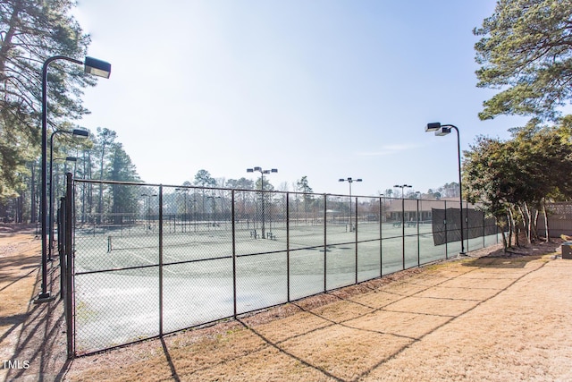 view of sport court with fence