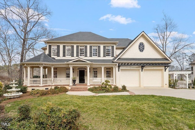 view of front of house with roof with shingles, a porch, concrete driveway, a front yard, and a garage