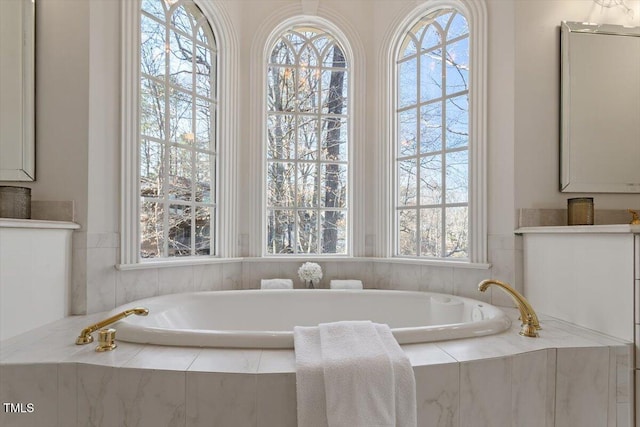 bathroom with a garden tub