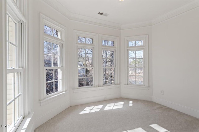 unfurnished sunroom featuring a healthy amount of sunlight and visible vents