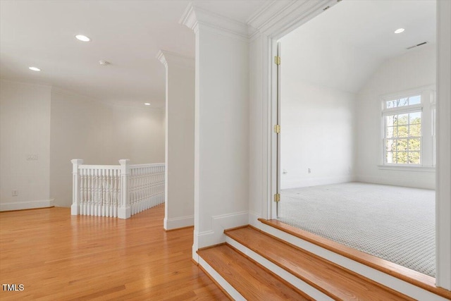 interior space featuring recessed lighting, visible vents, ornamental molding, light wood-type flooring, and baseboards