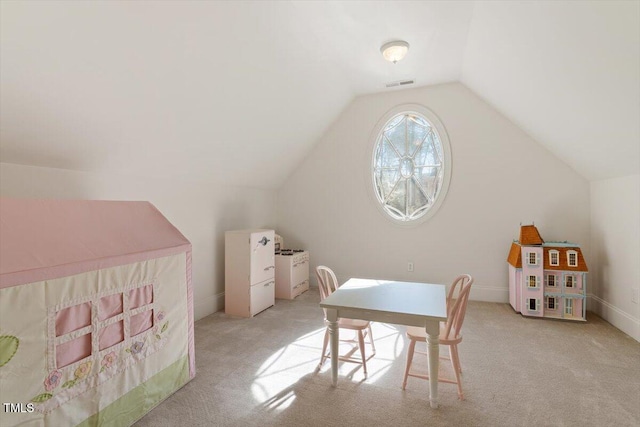 rec room with lofted ceiling, visible vents, and light colored carpet