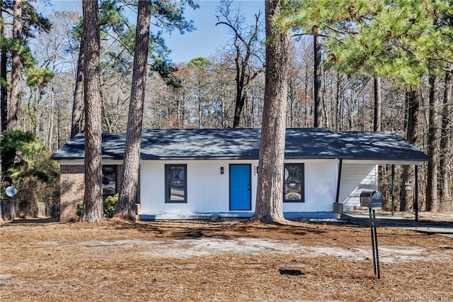 mid-century home with brick siding