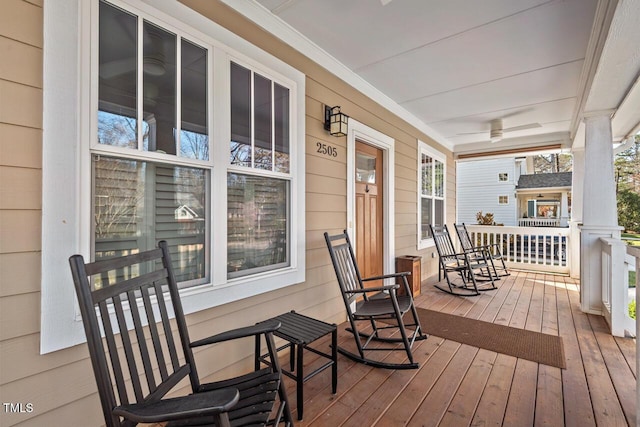 wooden terrace with a porch