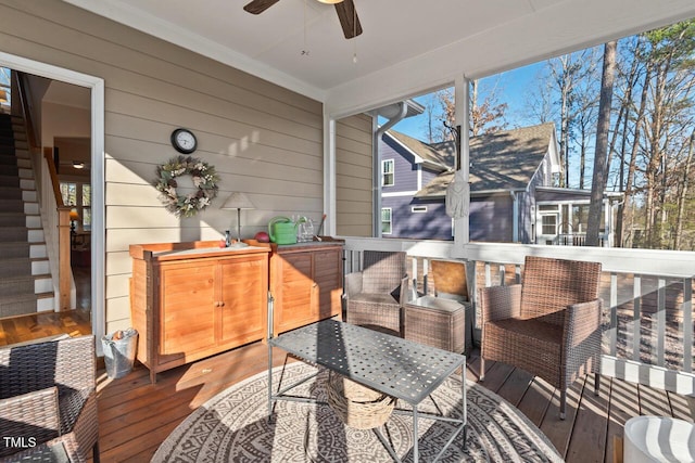 exterior space featuring a ceiling fan