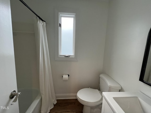 bathroom with shower / bath combo, baseboards, toilet, and wood finished floors