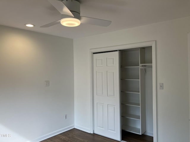 unfurnished bedroom featuring recessed lighting, a ceiling fan, baseboards, a closet, and dark wood-style floors