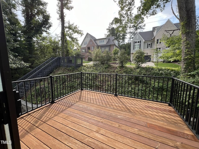 wooden terrace with a residential view