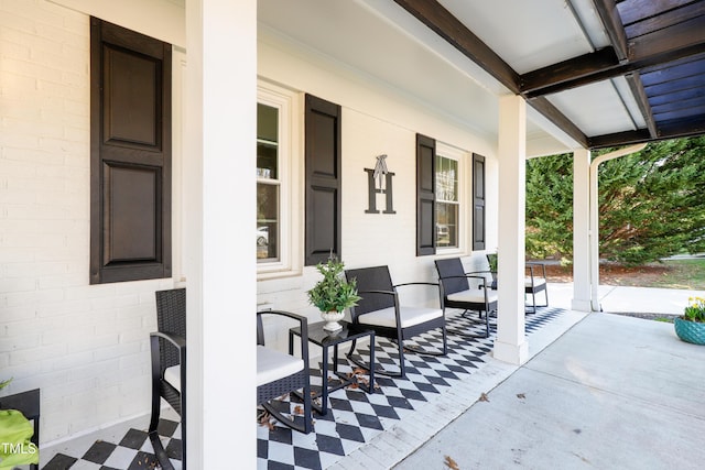 view of patio featuring a porch