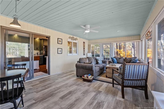 sunroom / solarium with ceiling fan