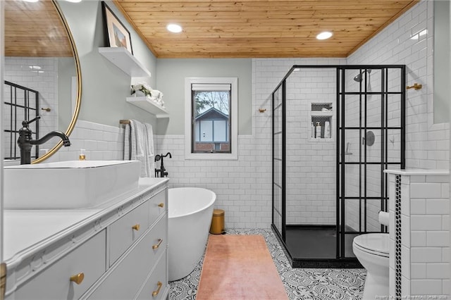 bathroom with a shower stall, wood ceiling, and tile walls