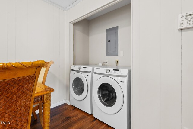 laundry room with laundry area, electric panel, dark wood-style flooring, crown molding, and washing machine and dryer