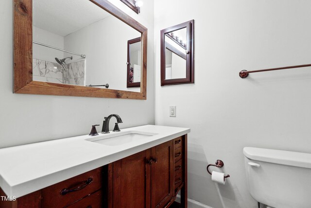 full bathroom featuring vanity and toilet