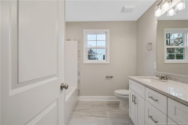 full bath featuring toilet, visible vents, baseboards, and vanity