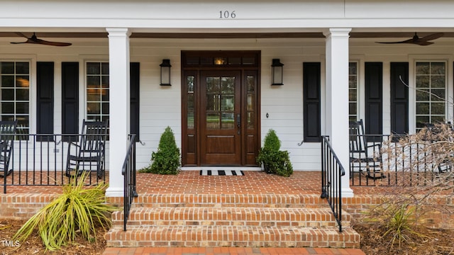 property entrance with covered porch and ceiling fan