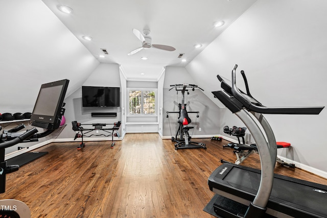 workout area with visible vents, lofted ceiling, a ceiling fan, wood finished floors, and baseboards