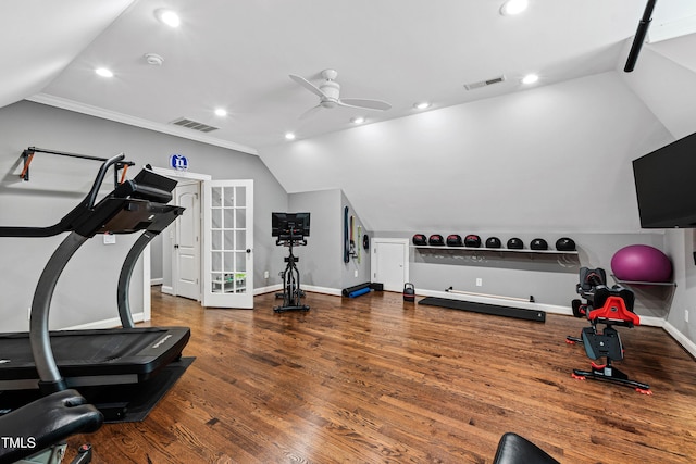 workout room with lofted ceiling, wood finished floors, and visible vents