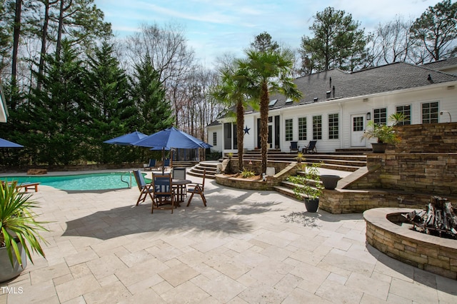 pool featuring a patio area and entry steps