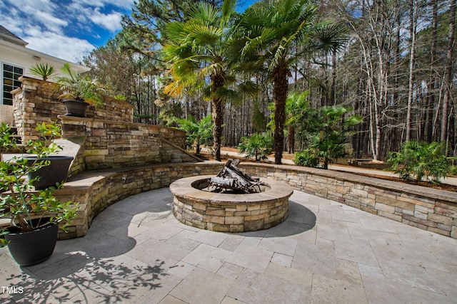 view of patio / terrace with a fire pit