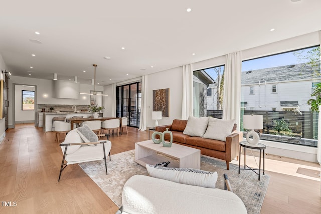 living area featuring recessed lighting and light wood finished floors