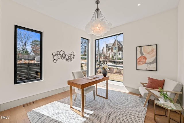 office area with a notable chandelier, baseboards, wood finished floors, and recessed lighting