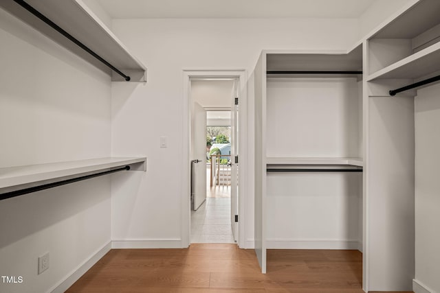 spacious closet with wood finished floors