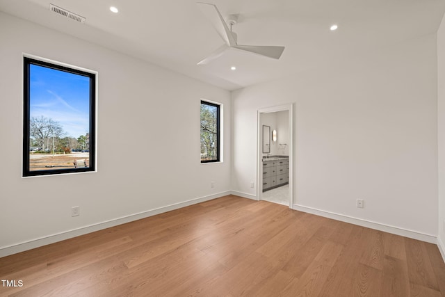 unfurnished bedroom featuring light wood-style floors, baseboards, visible vents, and recessed lighting