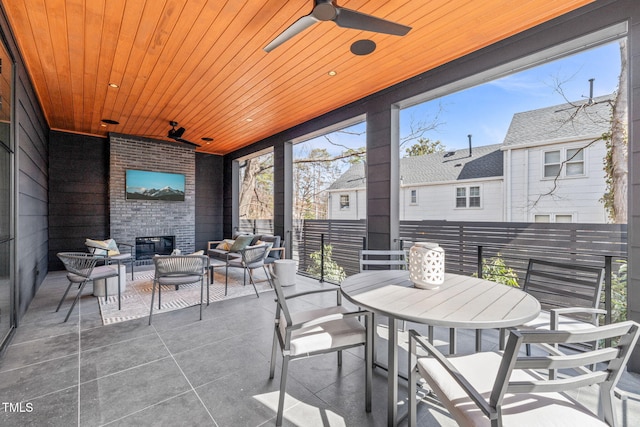 exterior space featuring wooden ceiling and ceiling fan